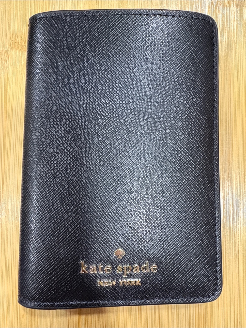 kate spade black leather travel passport wallet with gold logo
